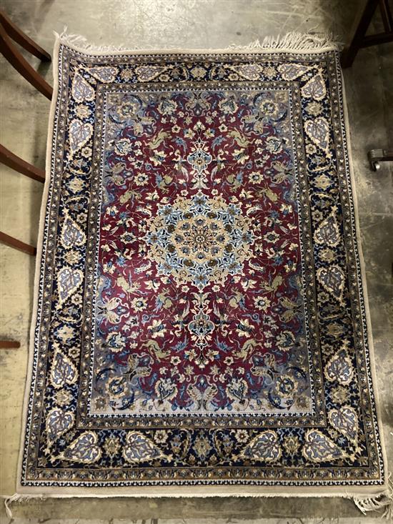 A Kashan burgundy ground rug, 152 x 109cm
